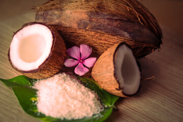 Coconut and grounded coconut flakes,homemade fresh hand traditional hand pressed coconut milk in small glass,