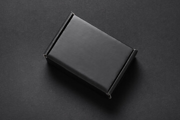 Black box on dark background, present, top view