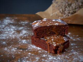 Caramel sauce poured over chocolate brownie. Delicious and freshly prepared brownie. Brownie cake...