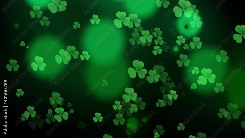 Poster ST Patrick's day background green clover leaf bokeh lights defocused for ST Patrick's day celebration motion design background