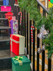 Vertical photo of Christmas gift boxes on the stair steps