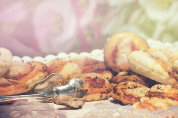 mini pizzas with copy space, closeup of appetizers with a retro style tongs on the left and empty space on the top for texts and graphics