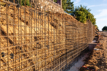 The construction of a retaining wall or counterfort, formwork, reinforced, preparation to pour...