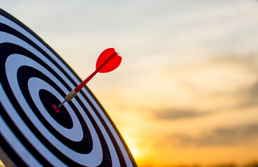 Red darts are placed in the center of the plate for darts and evening lights, a concept of...