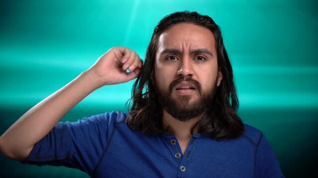Handsom beared Latin man shouts Oh My God seeing something distressing