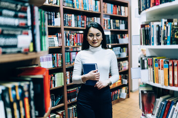 Asian female student studying in library