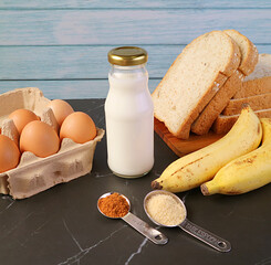 Ingredients of Banana Bread Pudding on Kitchen Table for the Concept of HOME-COOKING