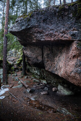 bonfire place beneath a protective cliff