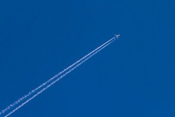 Airplane  flaying high in the blue sky