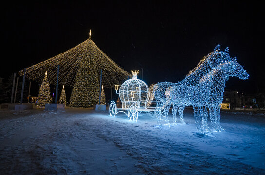 December, 2020 - Arkhangelsk. New Year's decorations and illumination. Carriage and horses. Russia, Arkhangelsk region