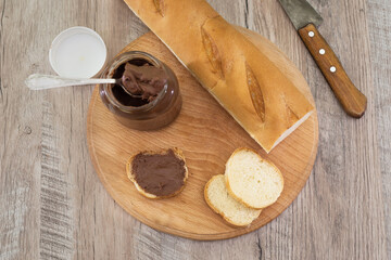 jar of chocolate nut spread and baguette slices