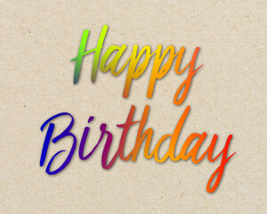 Colorful written word happy birthday on brown recycled paper background