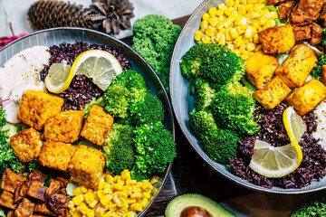 Vegan food with grilled tofu and  buddha bowl top view.
