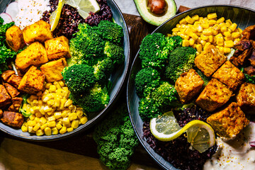 Vegan food with grilled tofu and  buddha bowl top view.