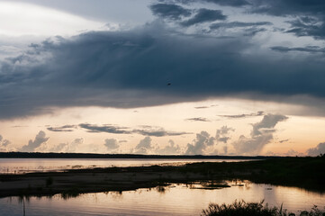 Fototapeta premium Amazon river, Amazon jungle, South America, clouds above the river, Peru, Ecuador