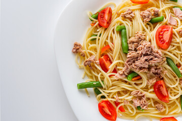 delicious traditional Italian pasta with tuna on a white background