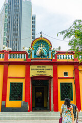 Subramaniam Swamy temple or hindu temple in Saigon (Ho Chi Minh city). Detail of the Trimurti above the entrance of the hindu Temple.