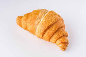 delicious fresh croissant on a white acrylic background