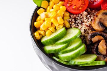 bowl of healthy quinoa with vegetables on a white background