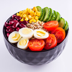 bowl of healthy quinoa with vegetables on a white background