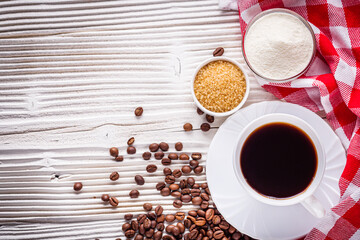 cup of fragrant fresh coffee on a white wooden rustic background