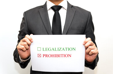 Concept of judge or lawmaker: the paper with the words legalization and prohibition is placed with...