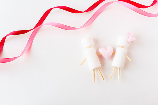 Background with a copy space on which conceptual figures from sweets are depicted.