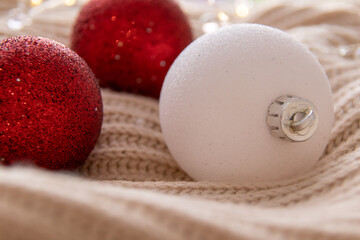 There are many red and white Christmas tree decorations. 