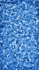 Blue wallpaper for a mobile phone. Abstract vertical winter background. Ice crystals on the window pane close-up. Tinted backdrop with vignetting frame. Macro