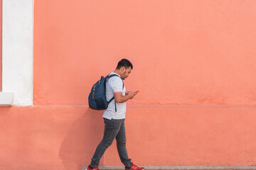 Obraz na płótnie Canvas Hispanic man walking down the street