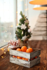 Christmas decoration. Christmas cooking. Dough, flour, cookies, tangerines, cup, mug, christmas ligths. box with fruit, opels on the windowsill old vintage