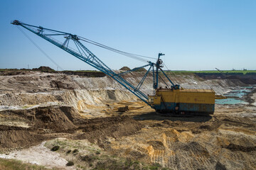 Walking excavator in a clay quarry