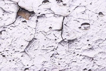 Silver wall surface with peeling paint. Empty template and mockup. Grunge and obsolete background.	