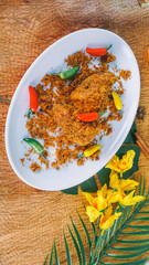 Ayam Serundeng Indonesian Chicken Recipe with Spiced Grated Coconut served on white plate