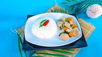 A plate of capjay or capcay ready to eat. capcay served with rice on white table