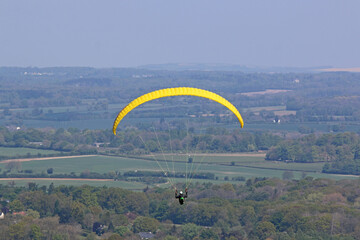 Paraglider flying at Combe Gibbet, England	