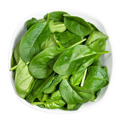 top view of fresh leaves of Spinach leafy vegetable in white bowl cut out on white background