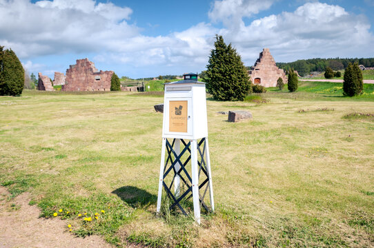 Mailbox on a background of ruins of the Russian fortress Bomarsund (19th century), built in 1834, destroyed in 1854. Finland, Aland Islands