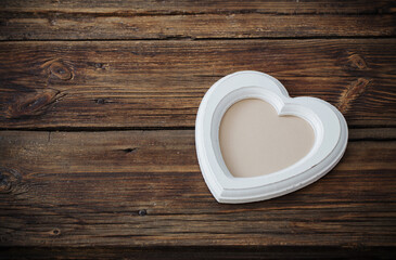 old white wooden frame on wooden table