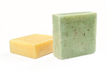 Two natural herbal soaps isolated on white background. Green and yellow square shaped products