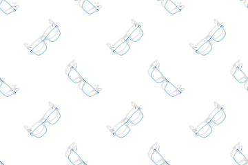 Background on the theme of glasses. White glasses seamless pattern on a white background.