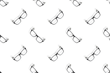 Background on the theme of glasses. Black glasses seamless pattern on a white background.