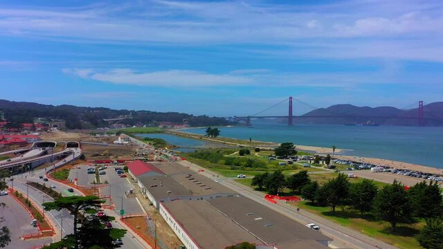 Panning drone shot of San Francisco bay looking at the Golden Gate Bridge and moving over toward Alcatraz.