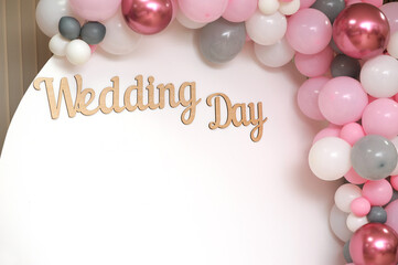 
inscription wedding day on a white background with colorful balloons