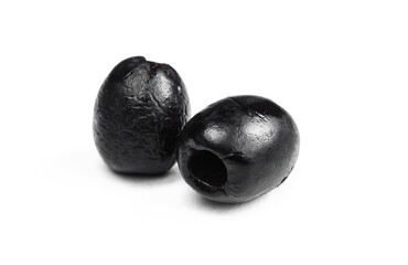 Two black olives isolated on white background. Organic natural fruits