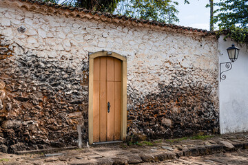 Wooden door on stone wall