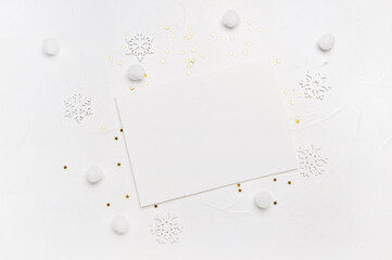 Christmas letter mockup of snowflakes and golden stars on white background. Winter holiday concept. Flat lay top view with place for your text