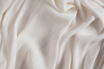 Draped light beige satin fabric
