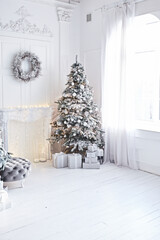 Beautiful christmas three. Christmas tree decoration. Big white room.  