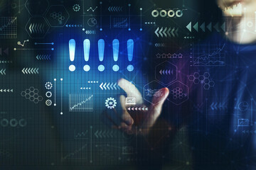 Exclamation marks with young man touching screen at night